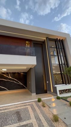 a modern house with an open garage door