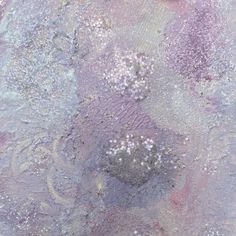 an abstract painting with white and purple colors on the surface is shown in this close up photo