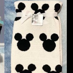 the mickey mouse towel has black and white polka dots on it