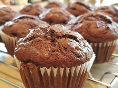 several chocolate muffins cooling on a rack