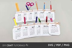 several calendars with markers and pencils tied to them