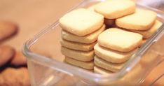 a plastic container filled with cookies on top of a table