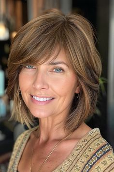 A jaw-length bob is a perfect choice for fine hair. Adding textured layers throughout will boost volume and movement, while side-swept bangs beautifully frame the face. Click here to check out more flattering and chic short hairstyles for women over 50 with fine hair. Short Hair Styles With Layers And Bangs, Cute Short To Medium Haircuts, Layered Bob With Side Swept Bangs, Medium Length Haircut For Fine Hair With Bangs Over 50, Short Length Haircut For Fine Hair, Fringes For Fine Hair Over 50, Hair Styles For Fine Hair Over 50, Fine Hair With Bangs, 2024 Haircuts For Women With Fine Hair