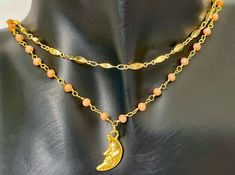 gold coral crescent moon necklace - 16 inches, adjustable - 24k gold plated charm, 18k gold plate chain - pendant is 8mm x 19mm layering necklaces shown in photos 5,6,7 listed here: https://www.etsy.com/listing/1740477242/18k-gold-plated-necklace-stack-textured matching earrings shown in the last photo listed in the earrings section of my shop! 💌 ships in environmentally friendly packaging 💌 free shipping over $35 Indie Jewelry, Orange Crystals, Crescent Moon Necklace, Crystal Chain, Gold Plated Necklace, Moon Necklace, Gold Plated Chains, Chain Pendants, Layered Necklaces