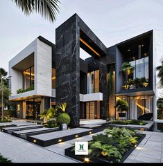 a large modern house with black and white exterior, surrounded by greenery in the front yard