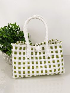 "SAGE GREEN TOTE HANDBAG  9.5\"x4.5\" WIDE Very durable and fashionable hand-woven market-style checkered handbag. We have many different colors available. This bag is made of premium plastic and embellished with beautiful beaded handles.  Let us help you replicate that special beach island getaway feels with imported Balinese products at wholesale prices. We are your source for crisp and clean bohemian coastal decor to echo that pure and organic lifestyle you've been looking for. We'll provide Trendy Green Bucket Bag With Large Capacity, Trendy Green Large Capacity Bucket Bag, Trendy Large Capacity Green Bucket Bag, Green Satchel Bag For Shopping, Trendy Green Large Capacity Bag, Trendy Large Capacity Green Bag, Trendy Light Green Bag For Everyday Use, Trendy Green Bucket Bag For Daily Use, Green Large Capacity Shoulder Bucket Bag