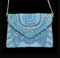 https://www.etsy.com/listing/1424538787/exquisite-turquoise-blue-beaded-clutch Blue Embroidered Shoulder Bag For Party, Handmade Blue Shoulder Bag For Festivals, Blue Rectangular Shoulder Bag For Festivals, Blue Embroidered Party Shoulder Bag, Blue Bohemian Bag For Evening, Traditional Blue Evening Bag, Blue Bohemian Clutch For Festival, Blue Bohemian Evening Bag, Blue Bohemian Clutch For Everyday Use