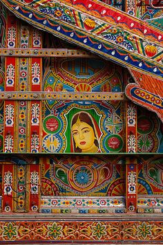 an elaborately decorated wall with colorful designs