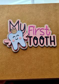 a sticker that says, my first tooth