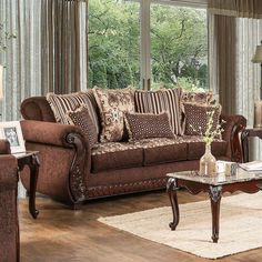 a living room filled with furniture and windows