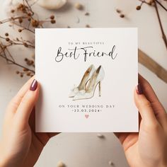 someone holding up a card that says, best friend on your wedding day with high heels