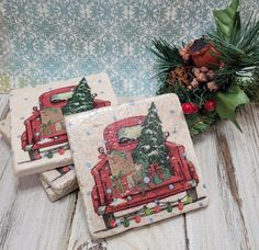 three coasters decorated with christmas scenes and pine cones