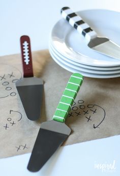 a football themed place setting with utensils and paper napkins on the table