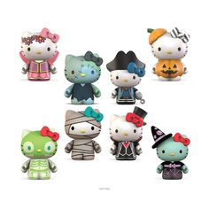 the hello kitty figurines are all dressed up