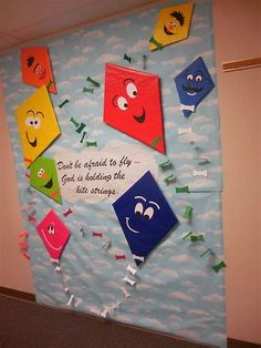 a bulletin board with some kites on it