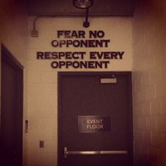 a sign on the door to an event hall that says fear no opponent respect every opponent