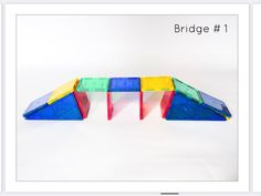 an image of a bridge that is made out of legos and plastic blocks with the text bridge 1 above it