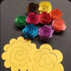 paper flowers are arranged on a table