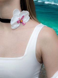 Length is adjustable: 40-50cm (15.7-19.6 inch)  Material: Artificial silicone flower, stainless steel hardware Handmade: Yes Manufacturing Time: 2-5 days  Elevate your summer style with this Hawaiian Pearl Pink Orchid Necklace Choker. Featuring a lifelike pink orchid made from high-quality artificial silicone, this necklace is perfect for embracing the mermaidcore aesthetic. The adjustable length of 40-50 cm ensures a comfortable fit, while the stainless steel hardware adds durability and a poli Summer Flower Jewelry For Vacation, Summer Vacation Jewelry With Flower Shape, Flower-shaped Summer Vacation Jewelry, Summer Vacation Flower-shaped Jewelry, White Beach Necklace For Spring, White Beach Necklaces For Spring, Adjustable Flower Necklace For Beach, Spring Beach White Necklace, Summer Beach Jewelry With Flower Shape