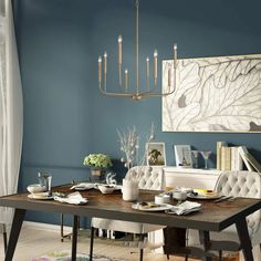 a dining room with blue walls and white chairs