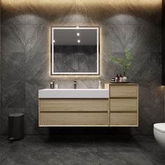 a bathroom with a sink, mirror and toilet in it's centerpieces