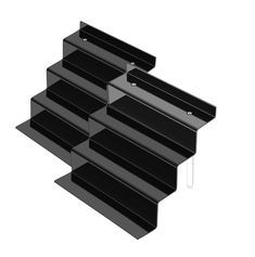 three black shelves stacked on top of each other