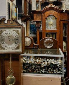 an antique clock is on display in a shop