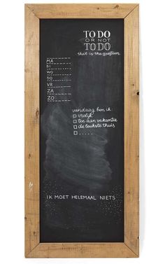 a chalkboard with the words to do written on it in front of a wooden frame