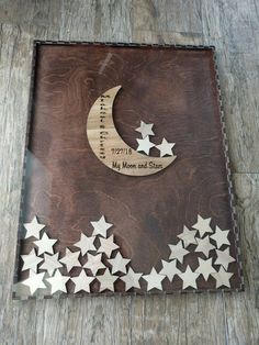 a wooden plaque with stars and a crescent on the bottom that says, my moon and star