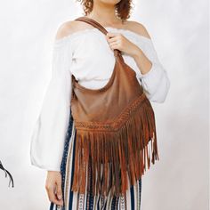 Have you always dreamed of a magnificent Boho bag with fringes that dance with your every movement? Dear, you're going to love our Wild Boho Dancing Fringe Shoulder Bag – simply a must-have Boho fringe bag that will be an eye-catcher wherever you go! Crafted from a gorgeous soft lamb leather with rich hues, this stunning Boho fringe bag features an exquisite detailed handwoven design, with stylish braided straps and amazing long fringes for a chic and whimsical Wild Boho style! ~ We absolutely l Fringe Hobo Shoulder Bag For Everyday Use, Everyday Use Bag With Fringe, Hobo Bags With Tassels For Everyday Use, Everyday Hobo Shoulder Bag With Fringe, Hobo Bag With Tassels For Everyday Use, Everyday Hobo Bag With Fringe, Fringe Hobo Bag For Everyday Use, Everyday Fringe Hobo Bag, Daily Use Hobo Bag With Fringe