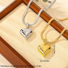 LOVCIA Light Luxury Titanium Steel Heart Pendant Necklace for Women - Stunning Gold & Silver Plated Elegant Necklace Introducing the LOVCIA Light Luxury Titanium Steel Heart Pendant Necklace for Women - a stunning gold & silver plated elegant necklace crafted with precision and care. Discover the elegance and charm of this exquisite piece from LOVCIA Jewelry, designed to elevate your fashion statement. Key Features: Material: Premium Titanium Steel Design: Heart Pendant Color Options: Gold & Sil Snake Chain Jewelry For Valentine's Day Anniversary, Metal Heart Beads Necklaces For Anniversary, Metal Necklaces With Heart Beads For Anniversary, Stainless Steel Collar, Black Friday Jewelry, Mens Stainless Steel Rings, Trending Necklaces, Necklace Craft, Elegant Necklace