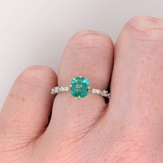 This minimalist 14K white gold setting features an earth-mined emerald with natural earth-mined diamonds. A delicate ring design perfect for an eye-catching engagement or anniversary. This ring also makes a beautiful May birthstone gift for your loved ones! The occasions to show off this ring are endless - mother's Day, graduation, wedding, birthday, date night, Christmas, etc. :) This ring is made with solid 14K Gold and naturally Earth-mined SI / G-H diamonds. Birthday Date Night, Birthday Date, Designer Silver Jewellery, Night Christmas, Jewelry Showcases, Zambian Emerald, May Birthstone, Birthstone Gifts, Delicate Rings