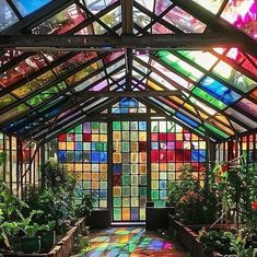 Happy Gardens 😀 on Instagram: "View from inside a stained glass greenhouse - stunning! 🤩" Garden With A View, Cool Greenhouse, Greenhouse Glass, Cute Greenhouse Interior, Greenhouse Colors, Pretty Windows, Colourful Greenhouse, Glass Greenhouse Attached To House, Whimsical Greenhouse