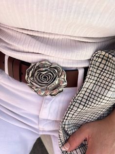 ''Smell the Roses'' is my new Leather Belt for Women that is made from Real Genuine Leather in brown color, with a unique silver Buckle at the center in flower Design. The quality of leather is at the highest level and the buckle is made from metal in silver color. Choose the ideal length for you between 6 different dimensions. (THE DIMENSIONS ARE FOR BELT NOT FOR YOUR WAIST) MATERIALS - Real Genuine Leather. - Metal Buckles. DIMENSIONS - Belt's Width 4 Cm (1.5'') - You can choose between Six di Leather Belt Women, Handmade Belt, Smell The Roses, Handmade Belts, Luxury Belts, Belt Women, Belt For Women, Boho Leather, Brown Leather Belt