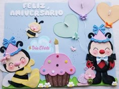 a greeting card with two cartoon characters holding cupcakes and balloons in the shape of hearts