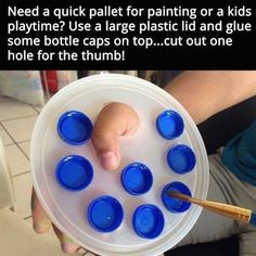 a person holding a plastic container with blue cups in it and the caption reads, need a quick pallet for painting or a kids playtime? use a large plastic