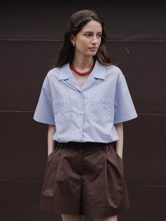 This is a trendy and feminine half shirt by THE RYE that is made out of high quality and sturdy material. With distinctive mood of the design and clean and refined look, you can style it for your modern and feminine daily outfit.- Feminine and comfortable mood- Soft touch of tencel and nylon blend fabric- Button and loop on the collar Casual Shirt With Vertical Stripes For Office, Pinstripe Tops With Pockets For Work, Striped Workwear Shirt With Pockets, Vertical Stripes Shirt For Office In Spring, Vertical Striped Shirt For Office In Spring, Chic Vertical Stripes Shirt For Workwear, Chic Shirt With Vertical Stripes For Work, Spring Office Shirt With Vertical Stripes, Relaxed Fit Top With Striped Collar For Business Casual