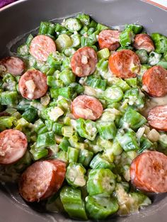 a pan filled with green beans and hot dogs