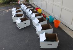 cardboard boxes are lined up on the ground