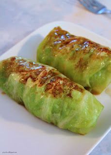 some food is sitting on a white plate and ready to be eaten with chopsticks