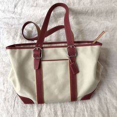 Natural Color Medium Size Canvas And Leather Tote. Never Used. Pockets On Inside For Phone And Small Items. Zipper On Top To Close. Small Mark On Side But Can Probably Be Removed With Some Soap And Water. 12 Inches Across At The Top. 10 Inches At The Bottom. 8 1/2 Tall. Straps Currently Set At 9 Inches But Adjustable. Coach Tote, Bags Coach, Small Items, Coach Bags, Natural Color, Leather Tote, Medium Size, Duffle Bag, Top 10