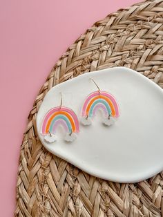 These lightweight Rainbow acrylic Dangles will add the perfect amount of color and whimsy to any outfit. Perfect for teachers, or just anyone who loves to stand out in a colorful and beautiful way.  Laser engraved right her in KS, hand painted and finished with our proprietary 14k PVD dipped non tarnishing stainless steel make these perfect for even sensitive skin. Introducing our Rainbow acrylic Dangles that will instantly brighten up any ensemble. Stand out in a colorful and beautiful way with our whimsical earrings that are sure to bring joy to your day. Playful Multicolor Personalized Earrings, Playful Personalized Multicolor Earrings, Hand Painted Multicolor Cute Earrings, St. Patricks Day, Rainbow Cloud, Saint Patrick, Laser Engraved, St Patricks Day, Laser Engraving