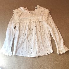 This Is A 100% Cotton Blouse That Is Embroidered With Floral And Geometric Designs. It Is Nwt From Zara In Size Xs. Lovely Off-White With Bib Design, Flared Cuffs, Buttoned In The Back At Top Of Blouse. It Is Supposed To Look “Unfinished” At The Hem, But A Great Boho Piece That I Never Got Around To Wearing, Sadly. Comes With Extra Button! Spring White Blouse With Ruffles, White Ruffled Blouse For Spring, White Long Sleeve Tops For Spring, Feminine White Tops For Fall, White Blouse For Fall Daywear, White Ruffled Top For Spring, Summer Long Sleeve Blouse With Broderie Anglaise, White Ruffled Tops For Fall, Feminine Broderie Anglaise Tops For Spring