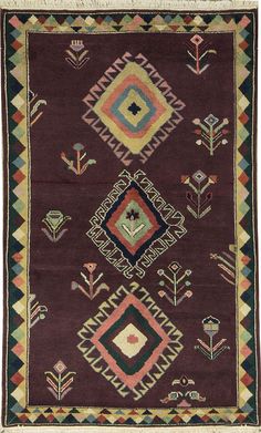 an old rug with different colors and designs on it's sides, including the center diamond