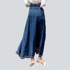 Welcome to the world of vintage-inspired fashion with our 2023 Autumn Collection Embroidered Oriental Long Denim Skirt. Crafted with exquisite details and high-waisted silhouette. this piece is a timeless classic with a modern touch. Feel the sun-kissed confidence and showcase your bold individuality as you sway gracefully in this y2k-trend skirt!Why This Skirt is a Timeless ClassicRetro meets modern in this exquisite piece that brings together bygone elegance with today's fashion pulse. With it Embroidered Wide-leg Denim Bottoms, Embroidered Wide Leg Denim Bottoms, Embroidered Denim Wide-leg Bottoms, Bohemian Wide Leg Denim Skirt For Spring, Spring Bohemian Wide Leg Denim Skirt, Spring Bohemian Wide-leg Denim Skirt, Embroidered Wide Leg Bottoms In Medium Wash, High Waist Embroidered Denim Blue Bottoms, Vintage Wide-leg Denim Skirt