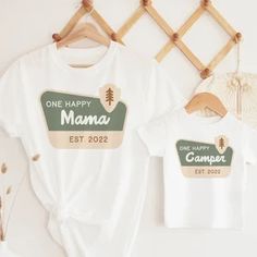 two t - shirts that say one happy mama and one happy camper on them