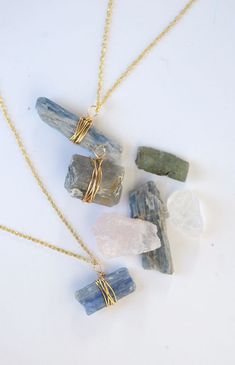 three necklaces with different stones hanging from it's sides and the words diy wire wrapped stone pendant