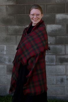 The brown and red plaid, Canadian Maple Leaf tartan blanket scarf can be added to the winter coat you have or wear it to top off that sweater you feel so comfortable in. It makes a great over-sized scarf gift for that special lady on your list. Cozy up your room my tossing this across your favorite chair as a throw. This scarf is made of the same Maple Leaf tartan pattern that the Duchess of Cambridge wore in Canada. More recently Princess Kate wore it on their Royal Tour. Be practical and wear Fall Plaid Shawl Scarf, Plaid Shawl Scarf For Fall, Scottish Plaid Winter Scarf, Tartan Blanket Scarf, Tartan Shawl, Air Force Families, Leaf Blanket, Tartan Plaid Scarf, Canadian Maple Leaf