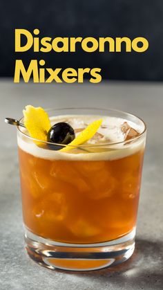 a close up of a drink in a glass with an olive on the rim and text that reads disaranono mixers