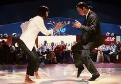 two people dancing on a dance floor in front of an audience